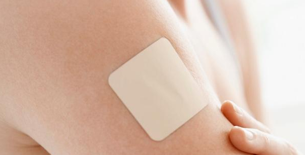 How does nicotine in the nicotine patch enter the bloodstream?